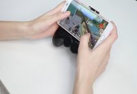 Bakery Multifunctional Gamepad with power bank Bluetooth speaker and folding stand for smartphone