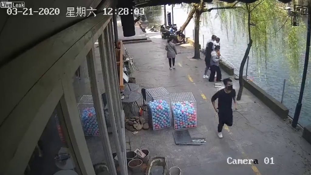 Liveleak com   Pub Owner Saves Boy After Bike Crashes Into River